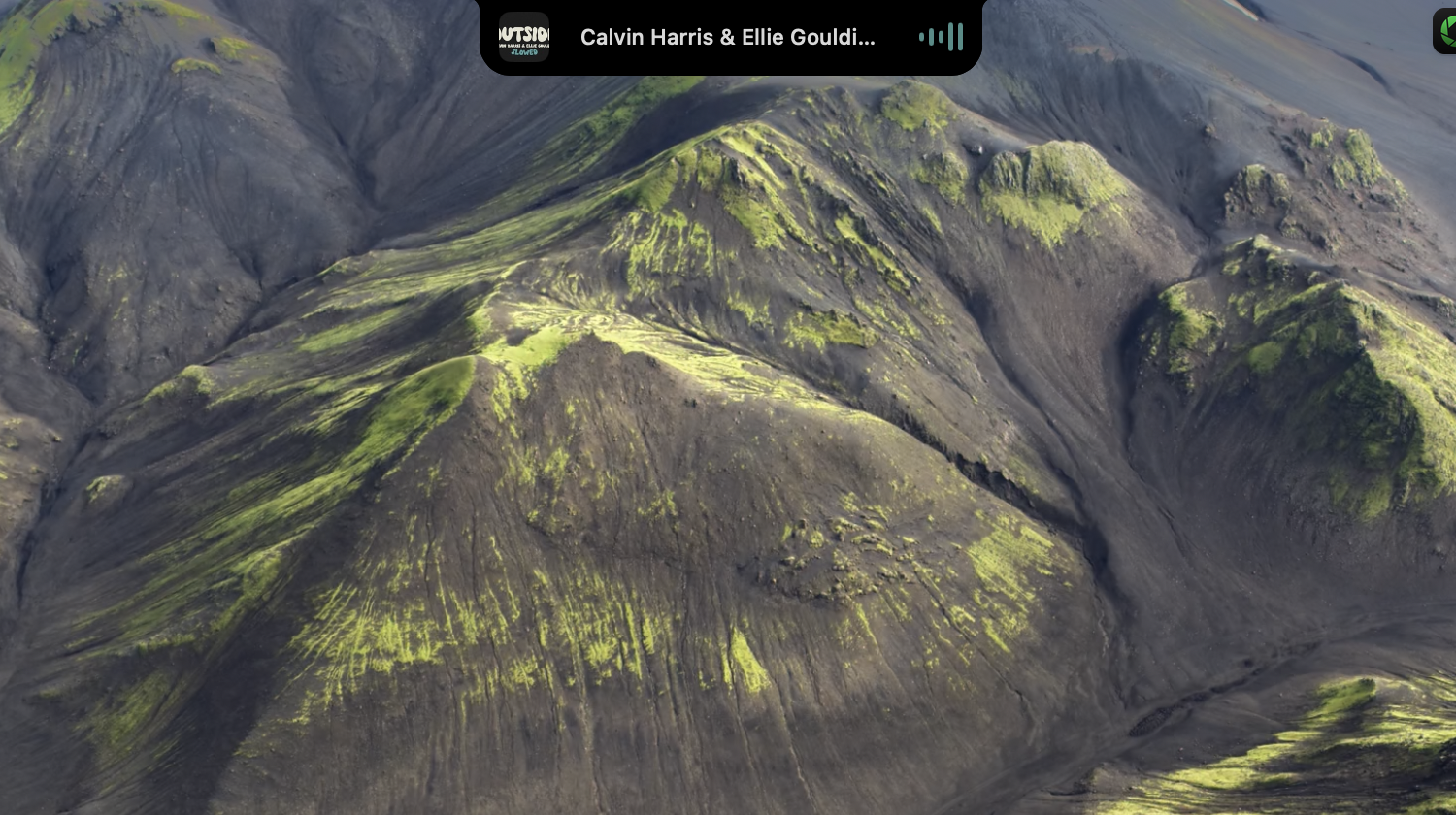 MusicNotch — collapsed notch view showing song name and visualizer
